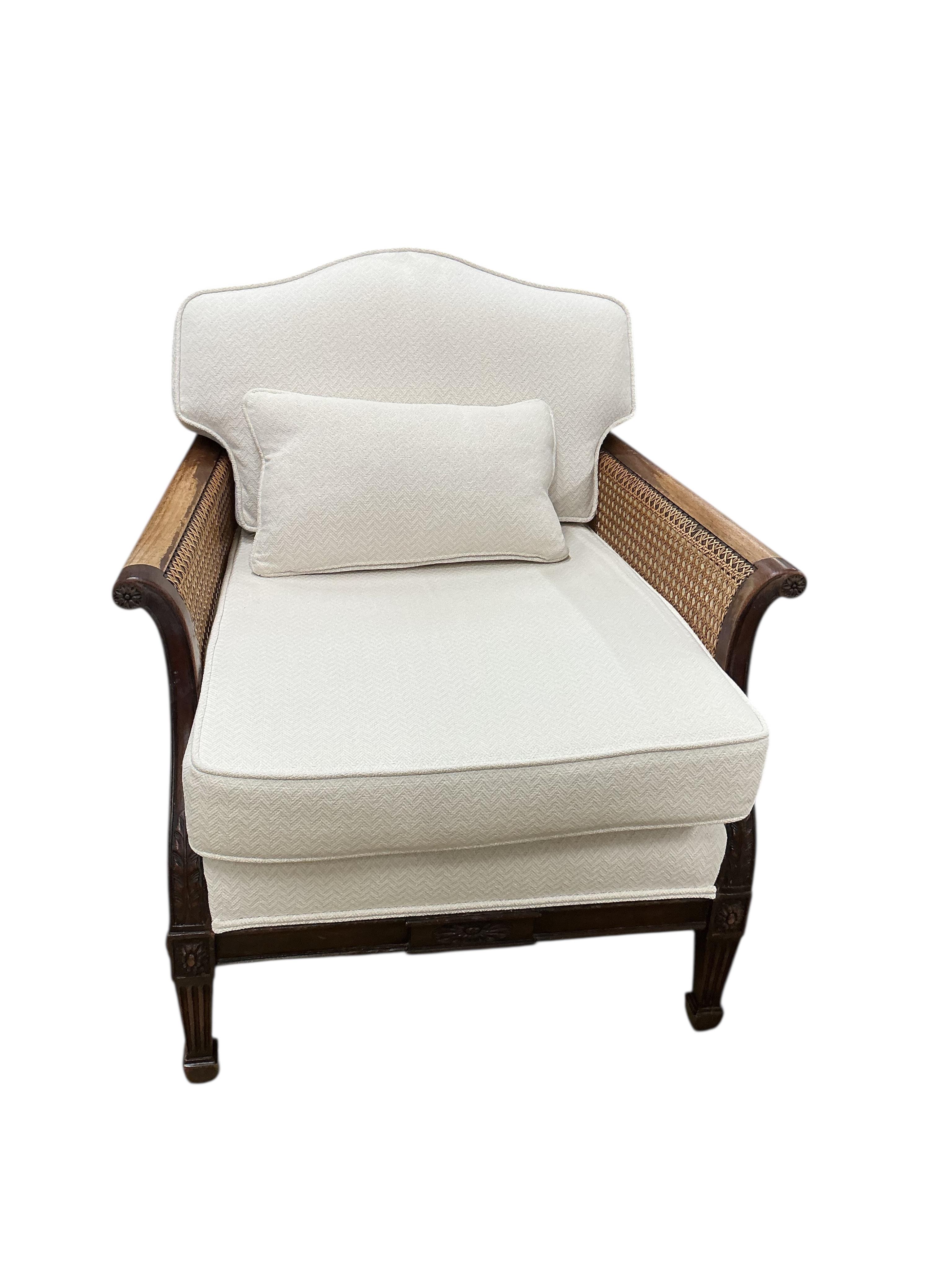 A pair of early 20th century mahogany bergere armchairs, width 75cm, depth 78cm, height 80cm